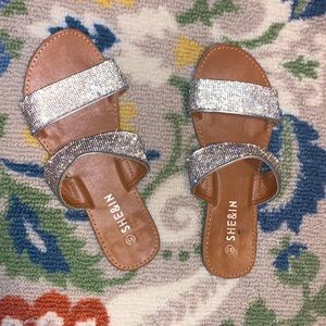 slide on sandals with diamond bedazzles.